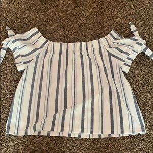 loose fitting shirt that sits on the shoulders